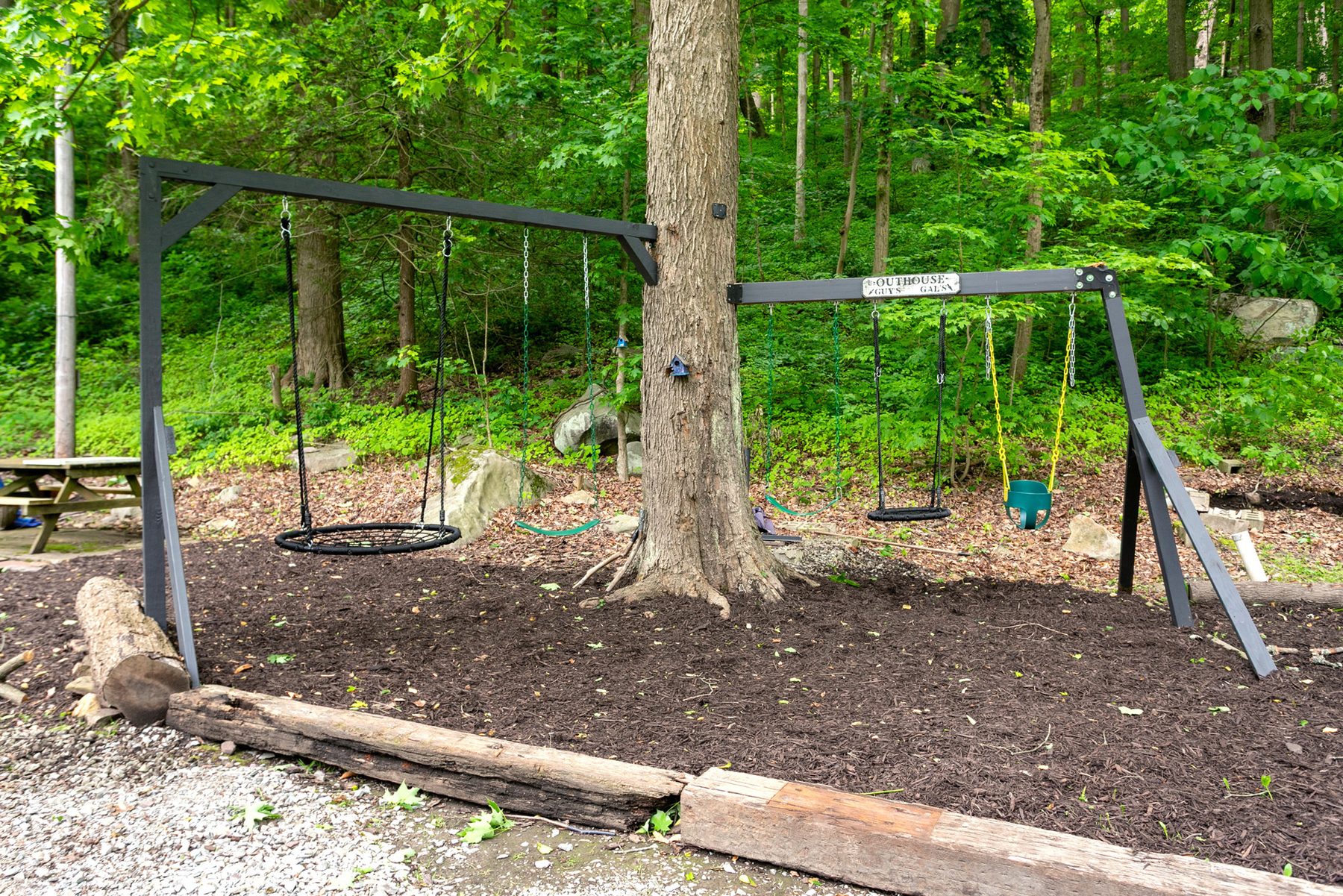 Swing set in the woods